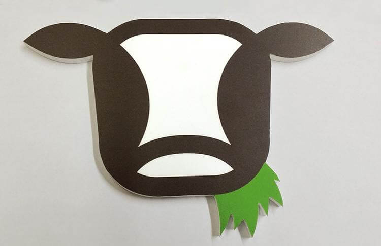 Wooden CNC cow head made of Sintra created for Munchkin Grass Fed